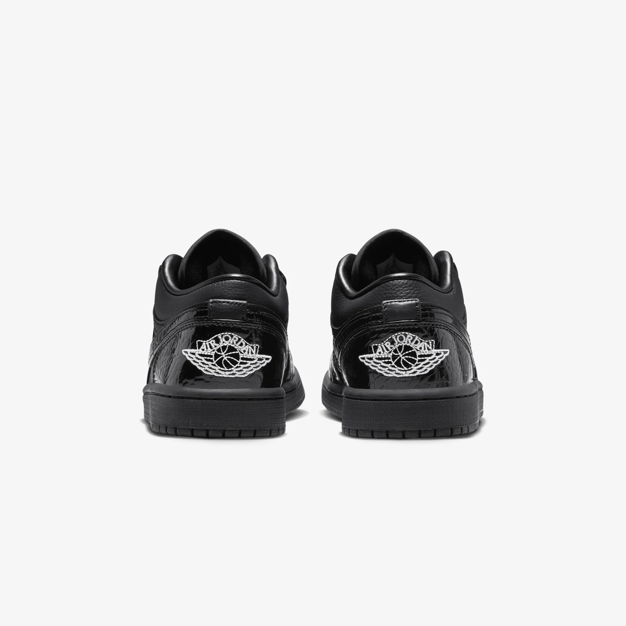 JORDAN | AIR JORDAN 1 LOW SE { BLACK/BLACK-WHITE-METALLIC SILVER - Image 4